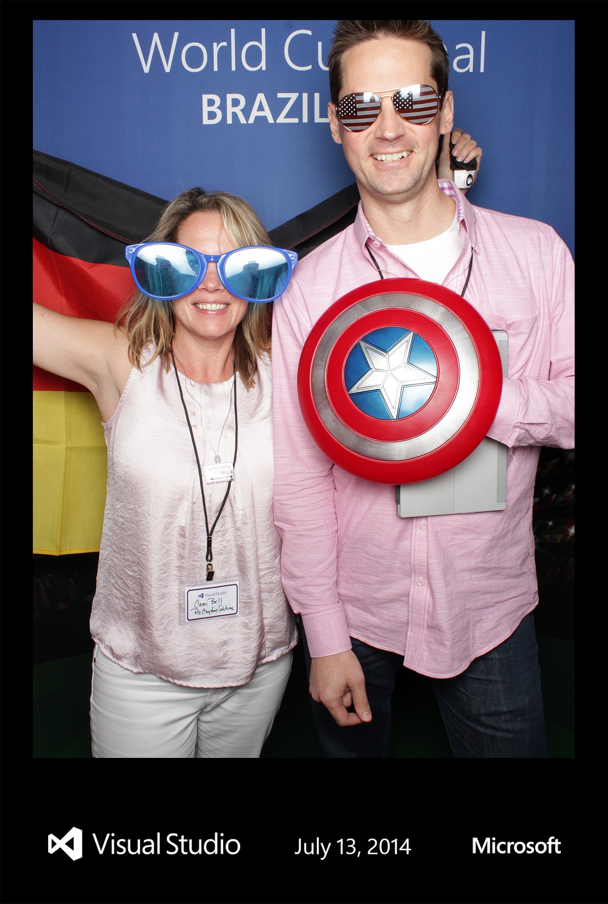 Soccer fans wearing fun props at a World Cup themed photo booth
